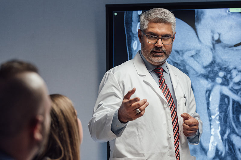 doctor speaking in front of group